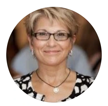 A portrait of Cindy wearing glasses